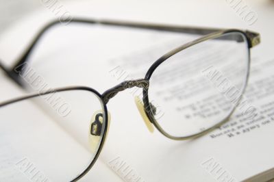Glasses on the book. Macro shoting