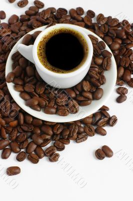 Coffee cup and grain on white