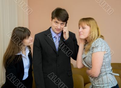 Man speaks by a mobile phone