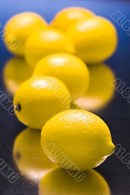 lemons on  blue reflective background