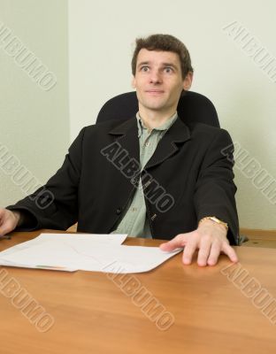 Clerk at office sits at a desktop