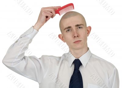 Absolutely bald guy with a hairbrush