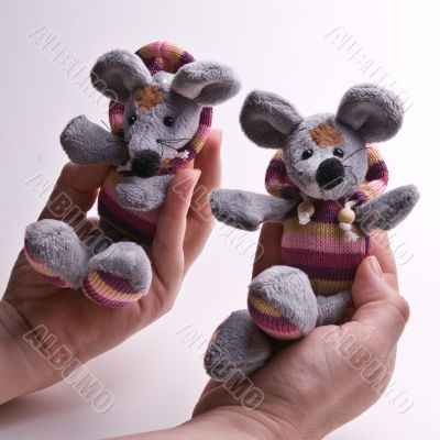 Cute small toys in hands Cute small toys in hands
