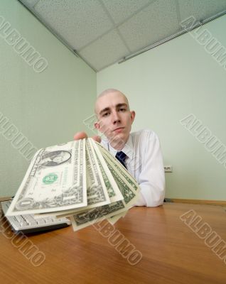 Chief stretching to us a pack of dollars