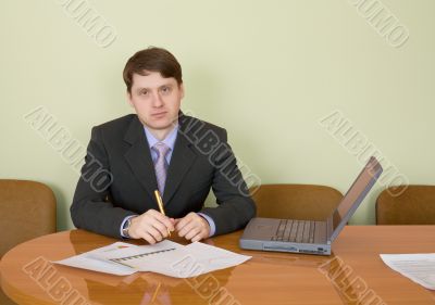 Businessman at a table with laptop