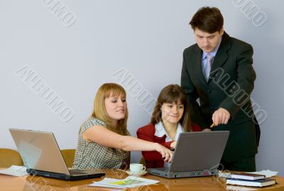 Girls at a desktop and their chief