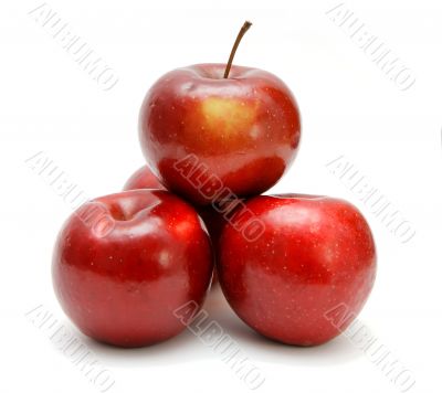 Four fresh red apples in a pyramid Four fresh red apples in a pyramid