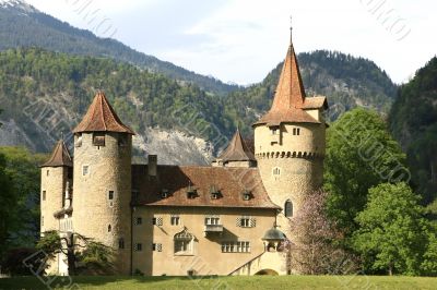 Castle in front of a mountain scenery