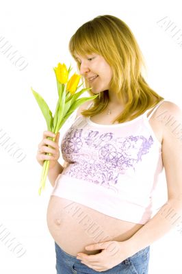 pregnant woman with yellow tulips