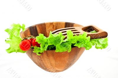 lettuce leaves and tomatoes in a salad bowl