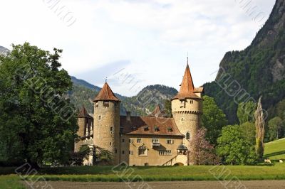 Castle in front of a mountain scenery