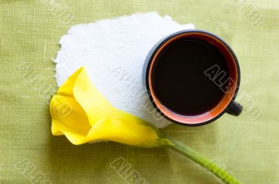 a cup of coffee and a calla