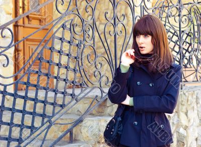 Brunette against grate Brunette against grate