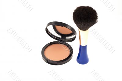 face powder with mirror and a brush