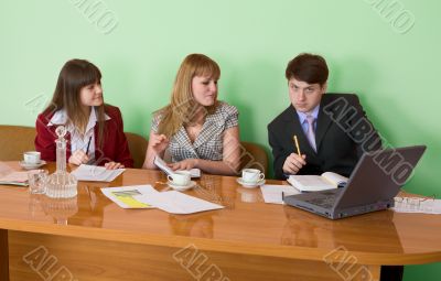 Business team sits at the table