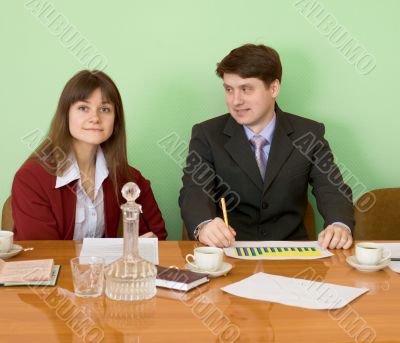 Business team sits at the table