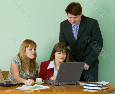 Girls at a desktop and their chief