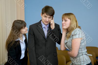 Man speaks by a mobile phone