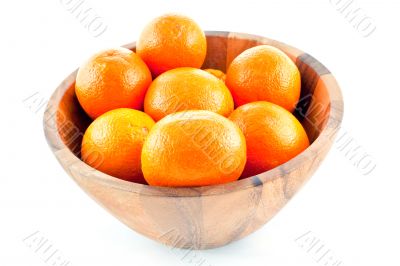 wood dish full with oranges