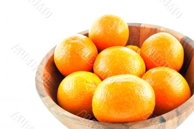 wood dish full with oranges