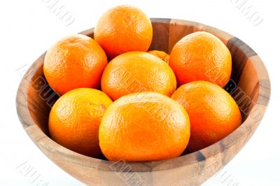 wood dish full with oranges
