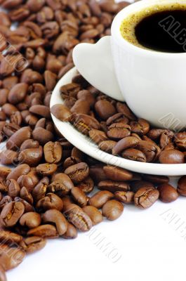 Coffee cup and grain on white