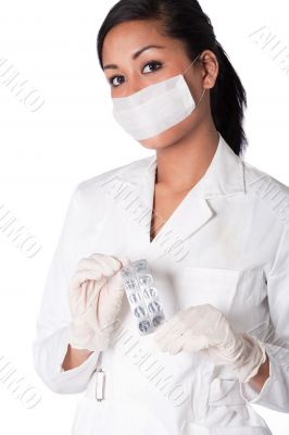 Beautifull Indonesian nurse with cap and pills