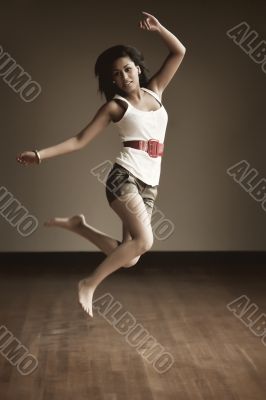 Portrait of an Indonesian girl jumping
