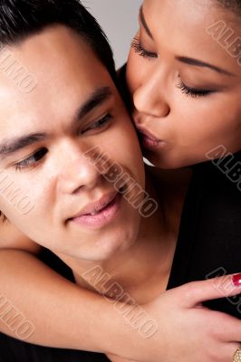 Gently kissing my Indonesian lover on his cheek