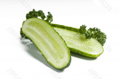 Cutted cucumbers and parsley, healthy food isolated on white