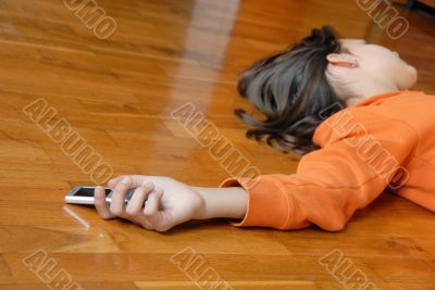 Teen girl lying on floor