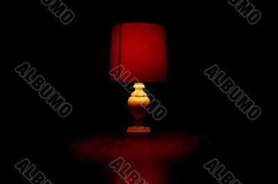 Red Light On A Table In Darkness