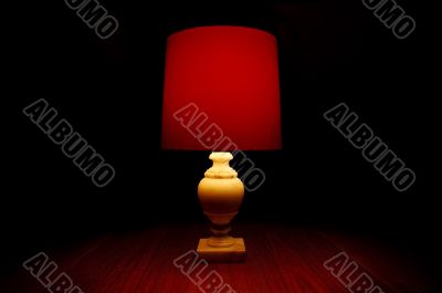 Red Light On A Table In Darkness