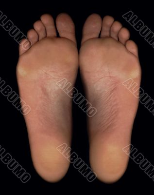 Barefoot feet with black background