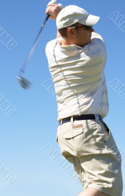 Golfer hitting the ball