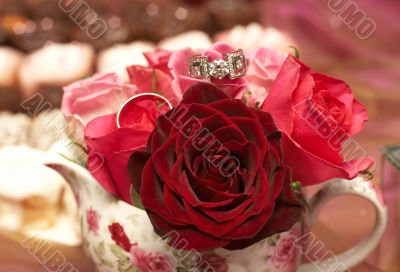 Bouquet of roses with wedding rings