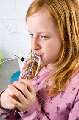girl is licking of whipped cream from a garder girl is licking of whipped cream from a garder