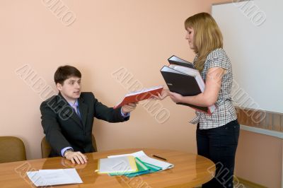 Secretary gives a folders to the chief