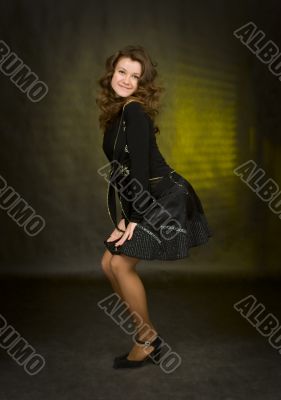 beauty girl in black on dark background