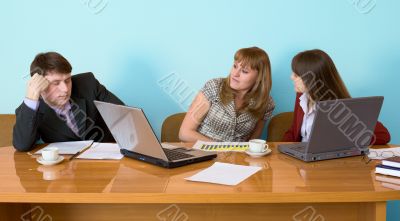 Businessman has fallen asleep sitting at meeting