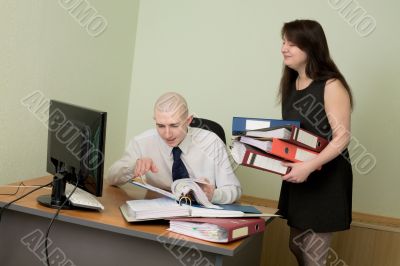 Bookkeeper and the secretary on a workplace Bookkeeper and the secretary on a workplace