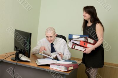 Bookkeeper and the secretary on a workplace