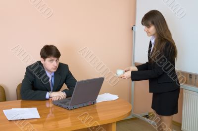 Secretary gives a cup to the chief