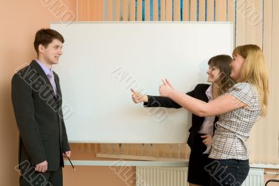 Office workers discuss work