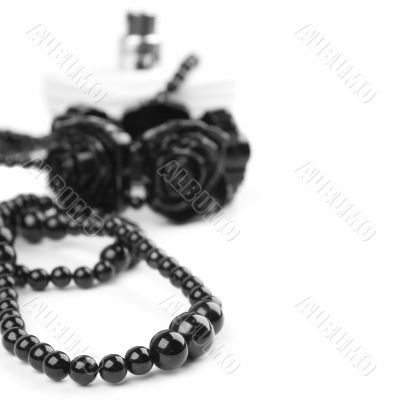 black necklace, bracelet and parfume