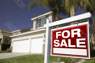 For Sale Real Estate Sign and House