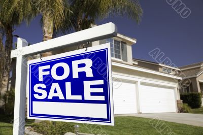 For Sale Real Estate Sign and House