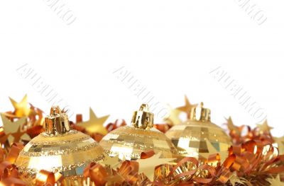 Gold Christmas baubles on tinsel