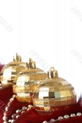 Golden Christmas baubles on fur Golden Christmas baubles on fur