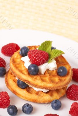 Belgian waffles with berries and cream